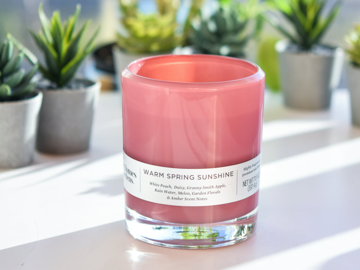 pink jar candle in Warm Spring Sunshine scent on white table
