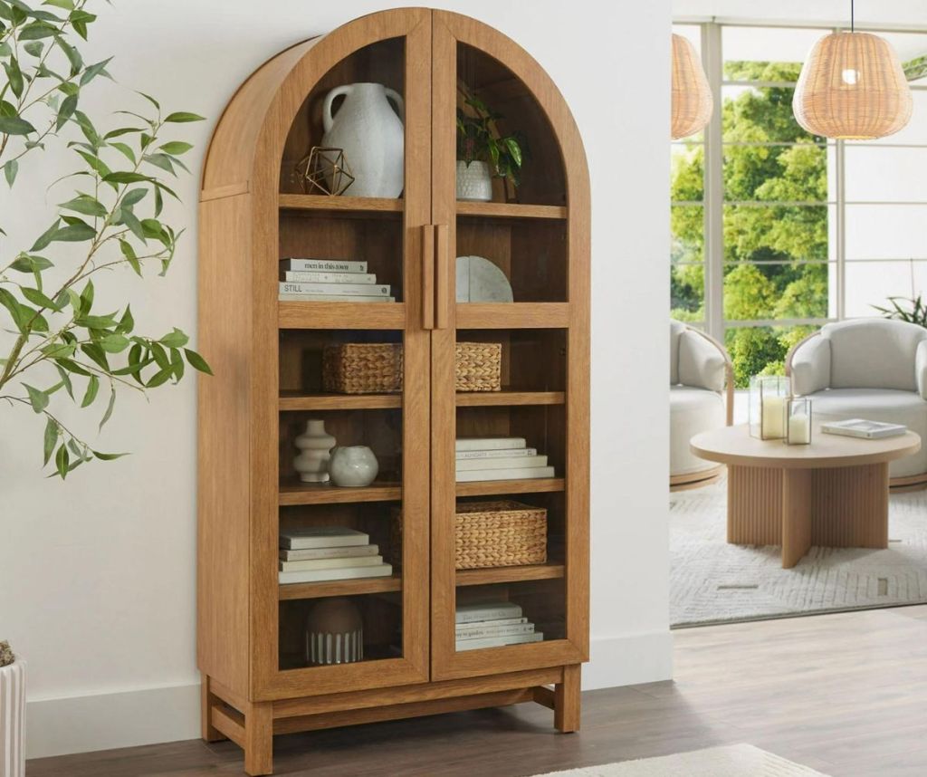 Better Homes & Gardens Juliet Rounded Solid Wood Frame Arc Cabinet in a living room