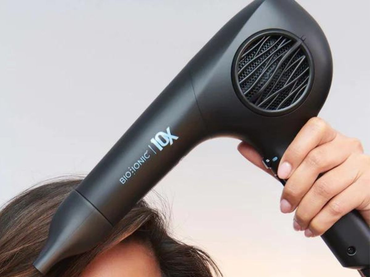 Woman using a Bio Ionic Blow dryer on her hair