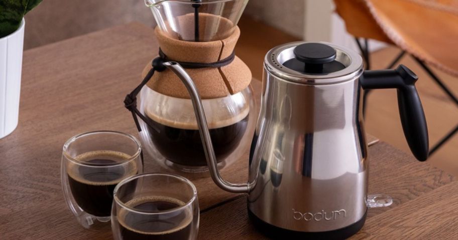 Bodum Pavina cups, pour over coffee maker and gooseneck kettle on a table
