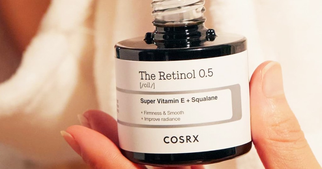 hand holding a jar of COSRX Retinol 0.5 Oil