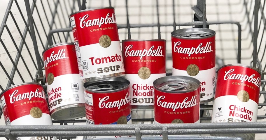 red and white cans of Campbell's Condensed Soups in shopping cart