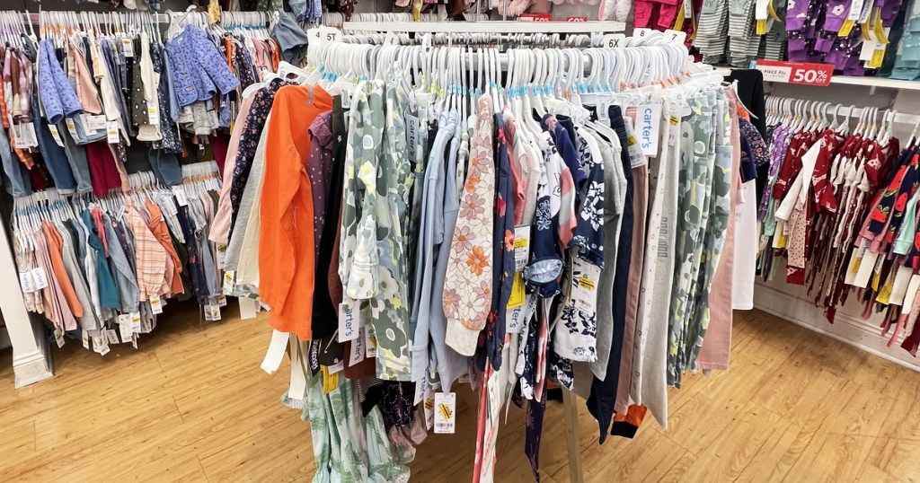 rack of clearance baby clothes in store