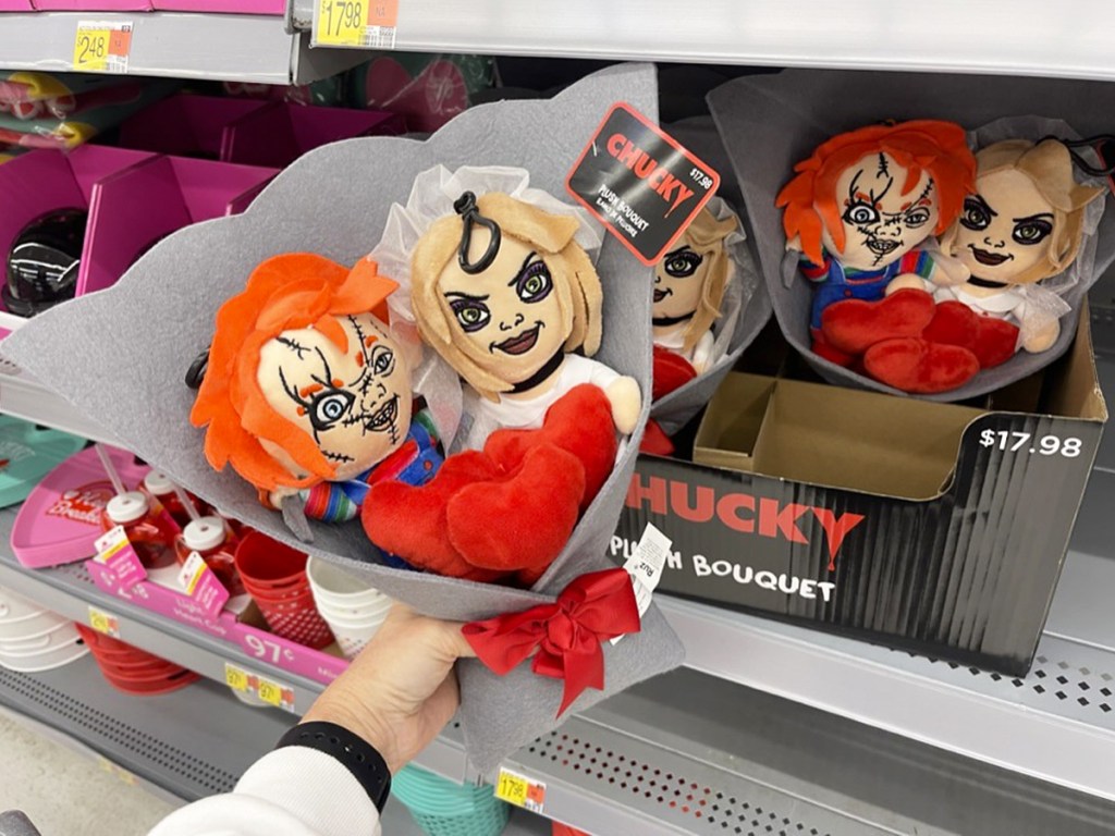 hand holding up a Chucky and Tiffany Plush Valentine's Bouquet