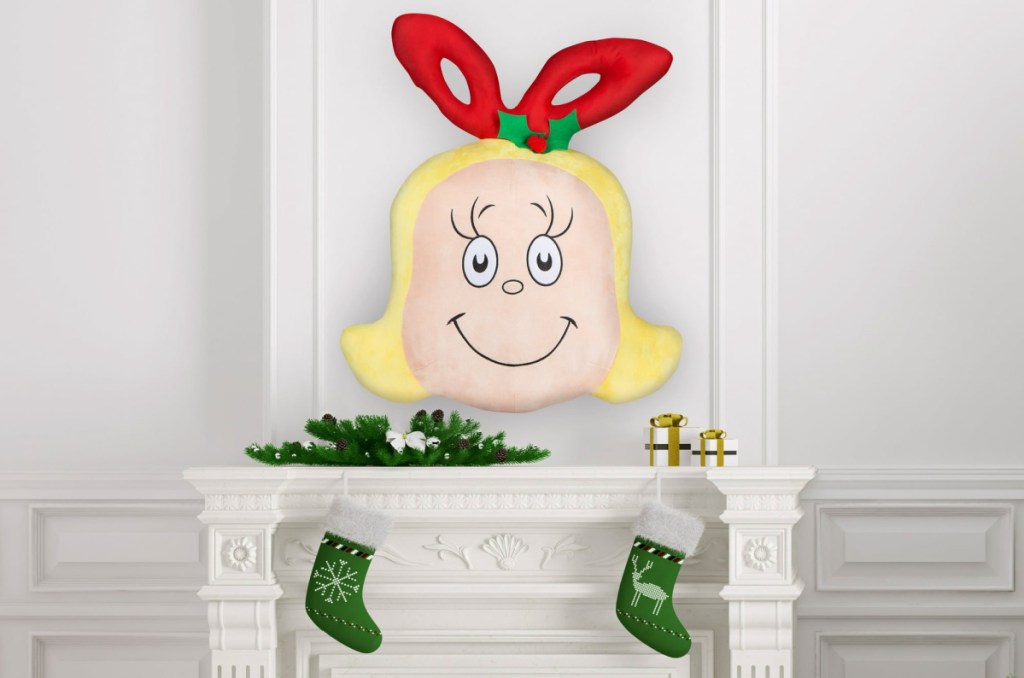 Cindy Lou plush displayed on top of a mantle