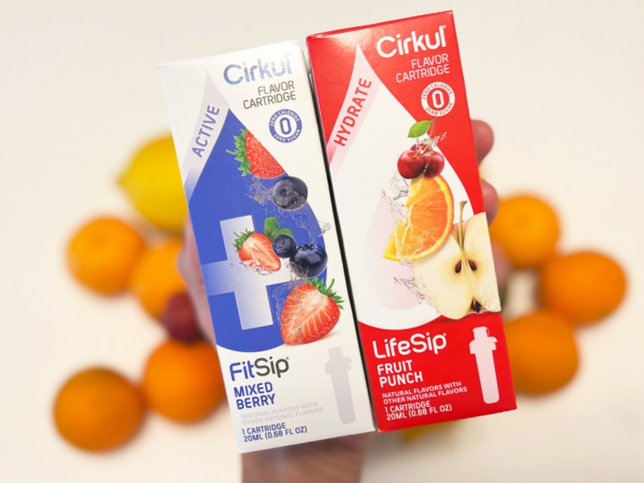 hand holding up two boxes of Cirkul LifeSip Cartridges