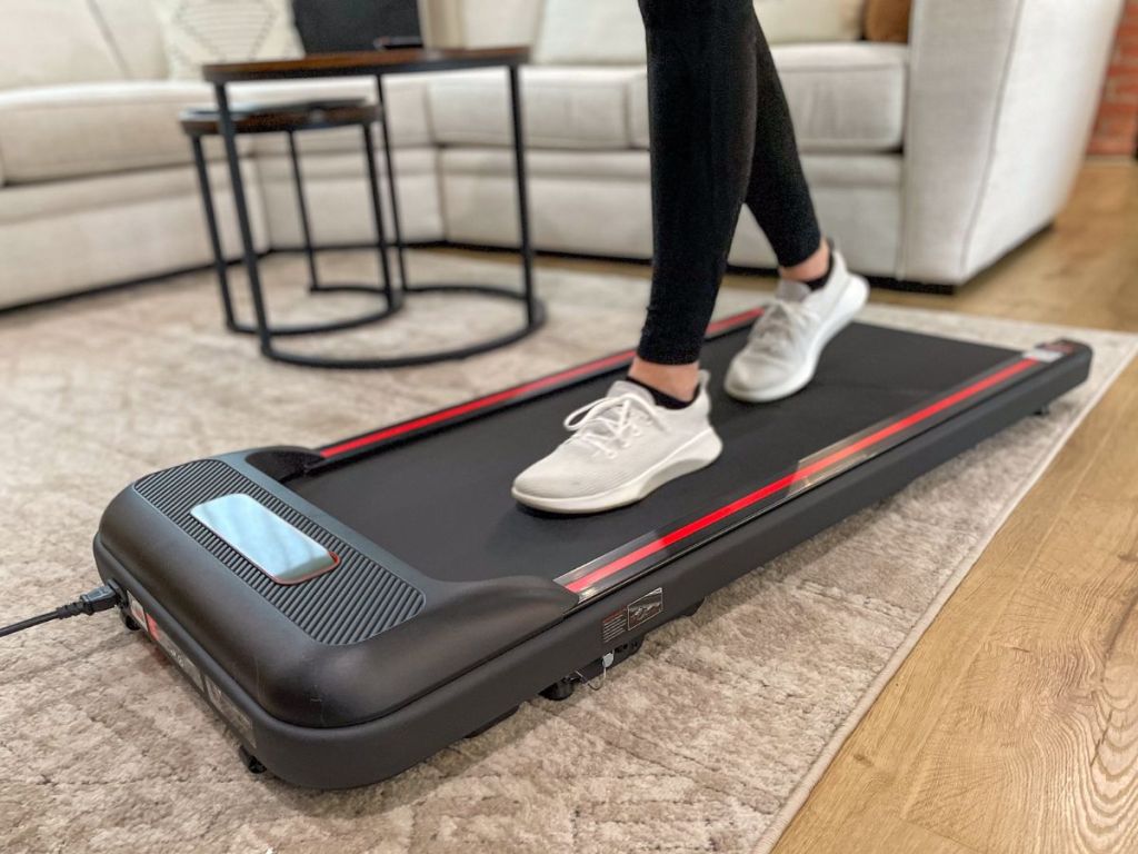 Shoes in sneakers walking on a on a treadmill