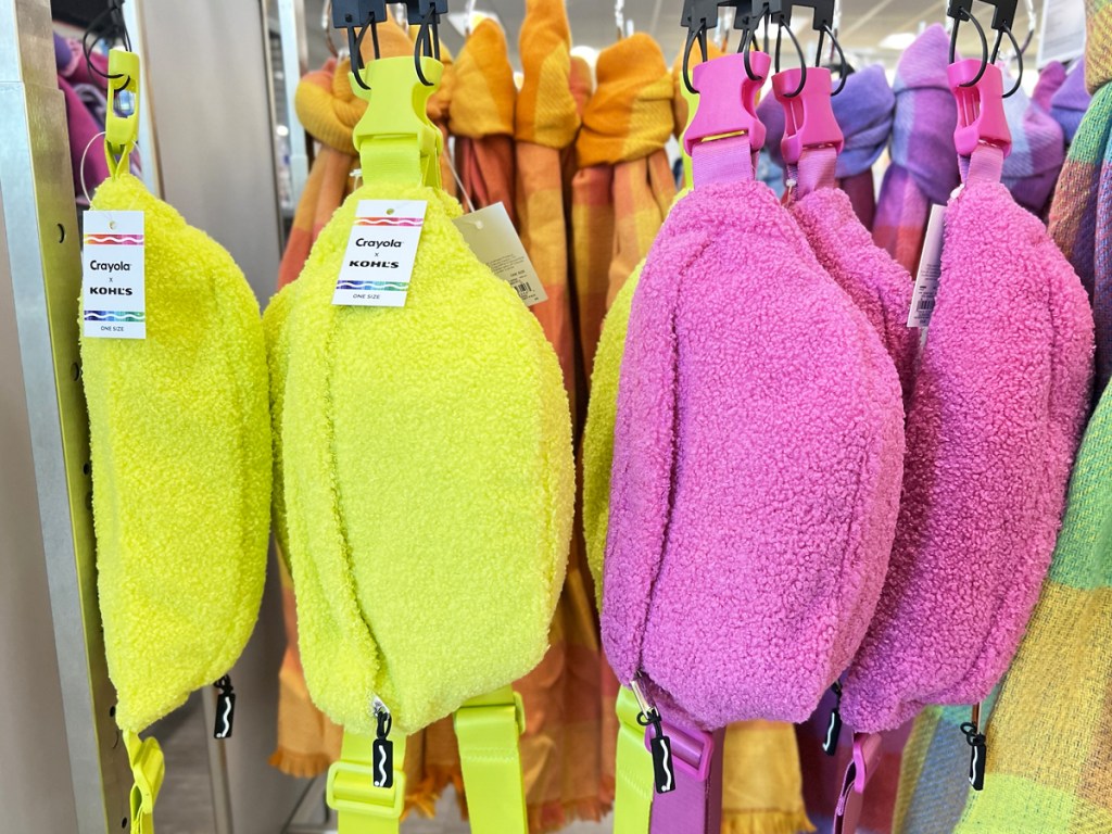 bright yellow and pink fuzzy fanny packs on store display