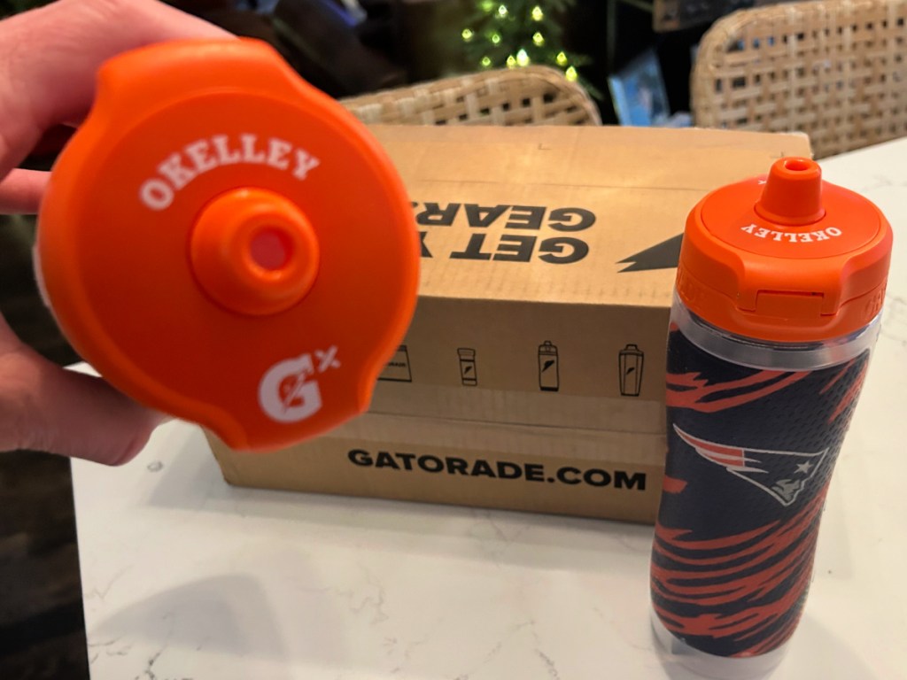 Custom nlf themed gatorade bottle lid with okelley on lid next to box on counter