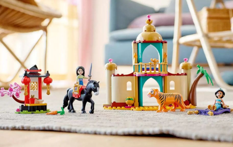 lego figures with castle on a rug