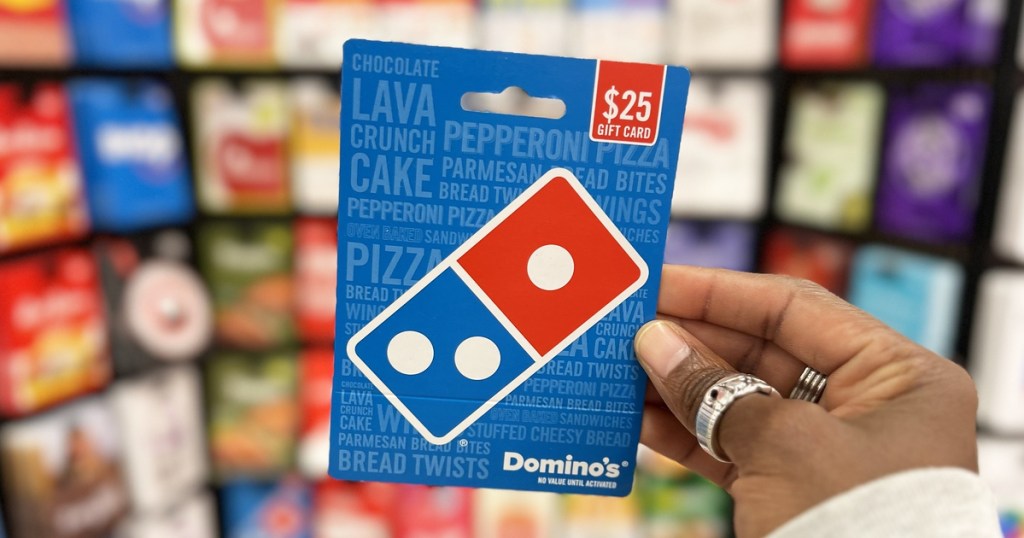 hand holding up a Domino's Gift Card