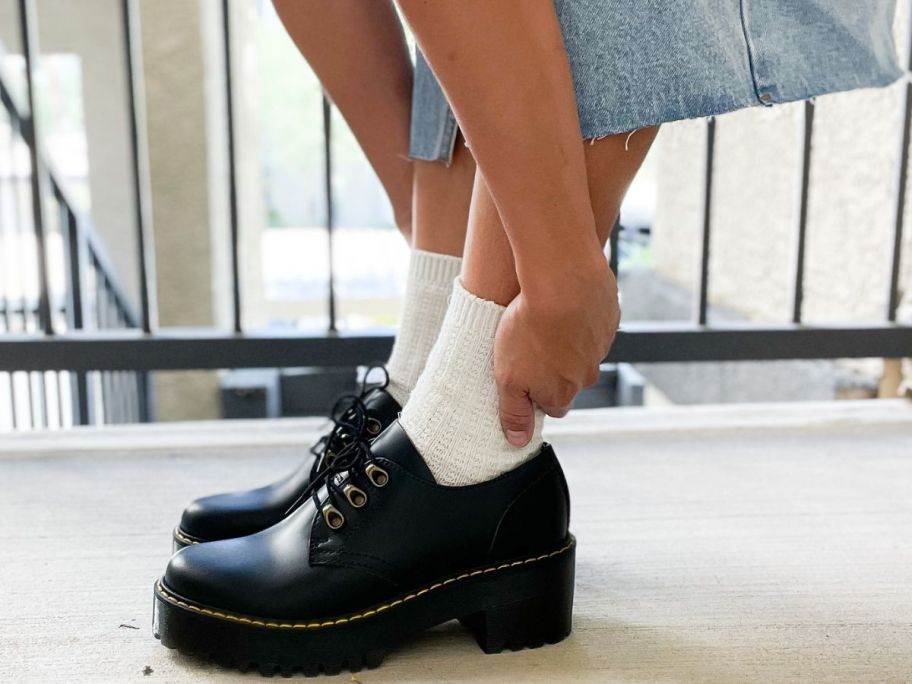 Woman's feet wearing Dr. Martens lug sole shoes