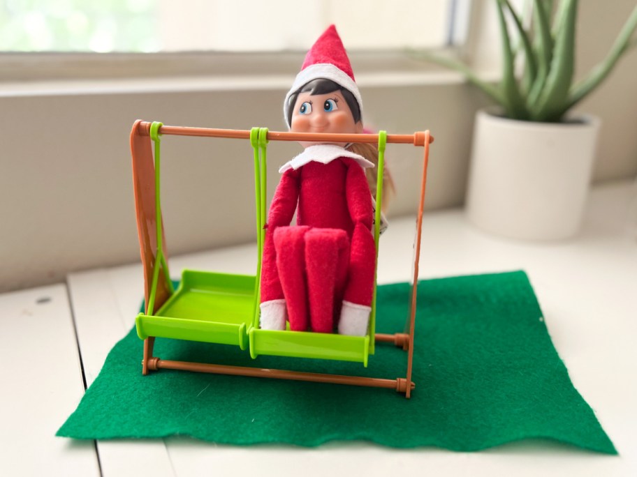 elf on a swing, one of our Dollar Tree Elf on a Shelf Ideas