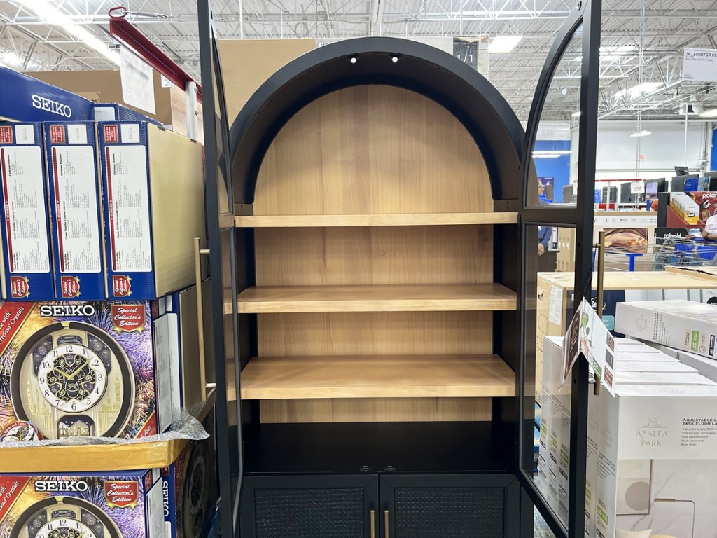 black arched storage cabinet with door opened