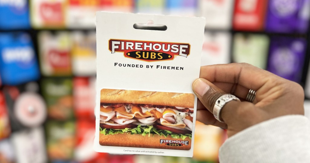hand holding a Firehouse Subs Gift Card