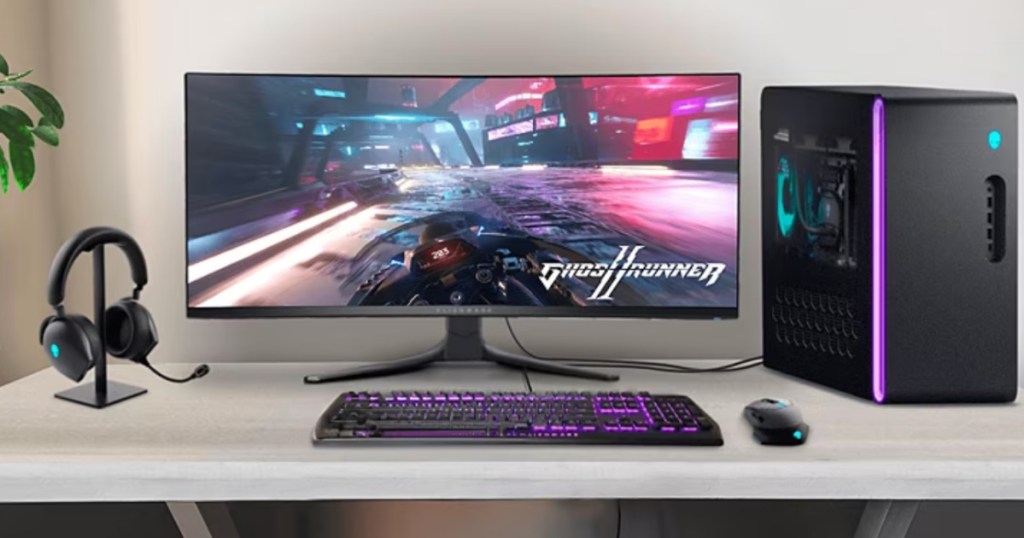 computer on desk with ALIENWARE DUAL MODE WIRELESS GAMING HEADSET and mouse