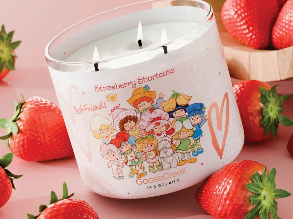 GooseCreek Strawberry Shortcake Candle next to strawberry fruit