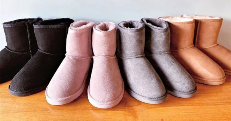 4 pairs of Dearfoams Shearling Boots lined up - black, pink, grey and tan colors