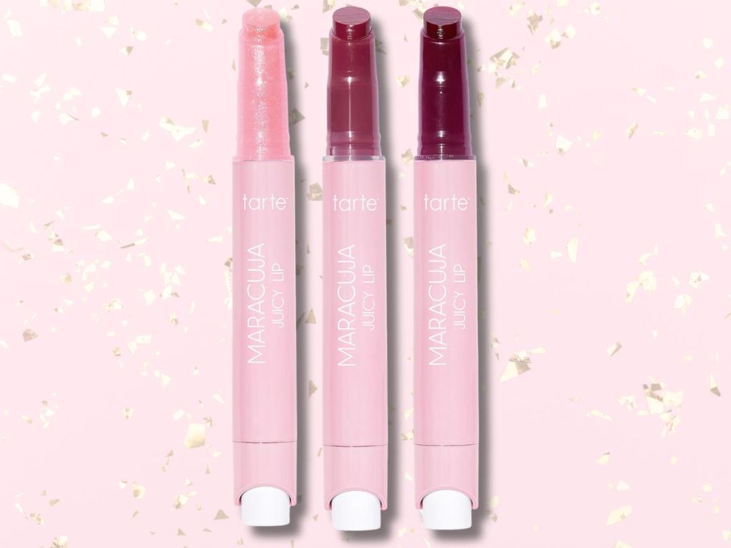 3 different colors of Tarte Maracuja Juicy Lip balms on a pink and gold background