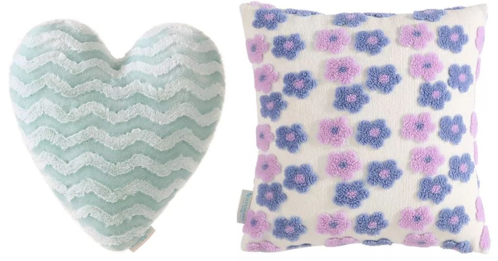 2 fuzzy, fluffy pillows, one heart shaped with blue stripes and one square pillow with purple flowers