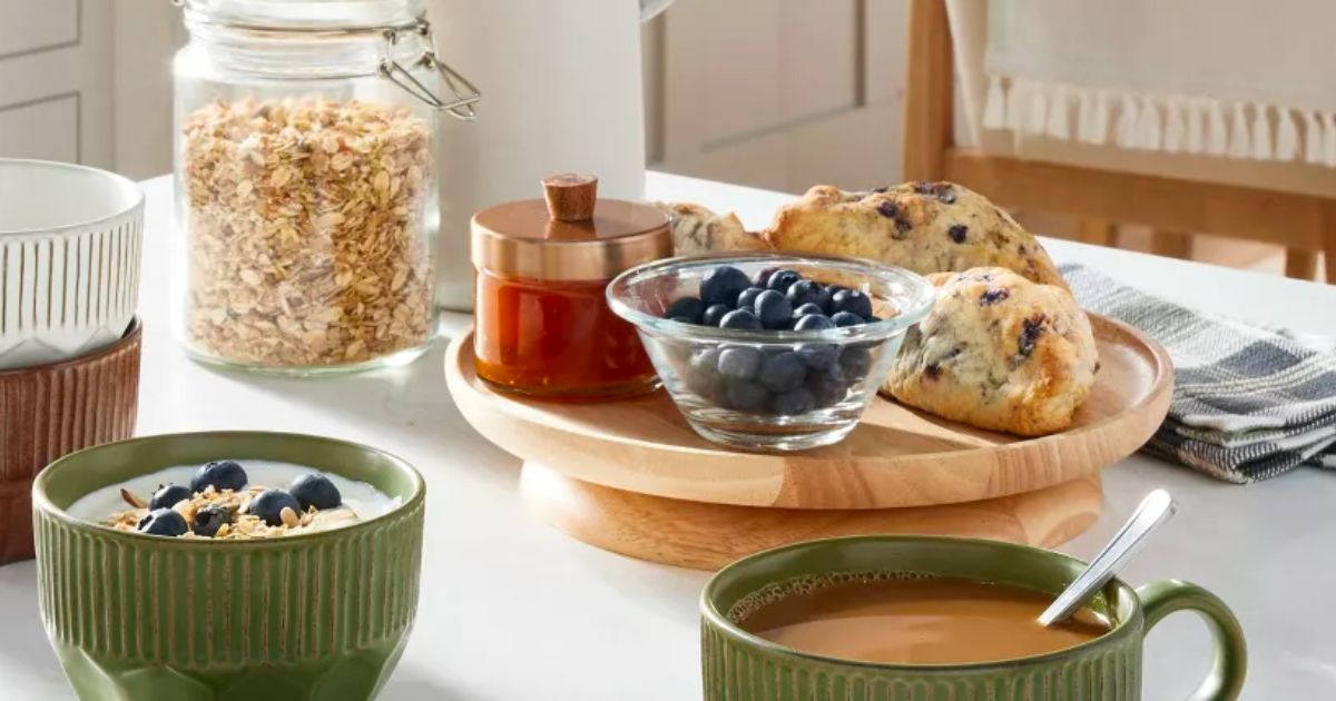 Hearth &amp; Hand w: Magnolia 10" Wooden Pedestal Lazy Susan on a counter top with blueberries and jam and muffins