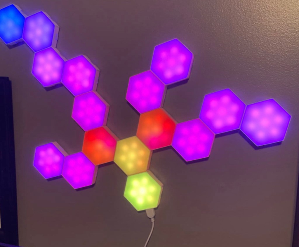 Colorful hexagon shaped LED lights hanging on the wall