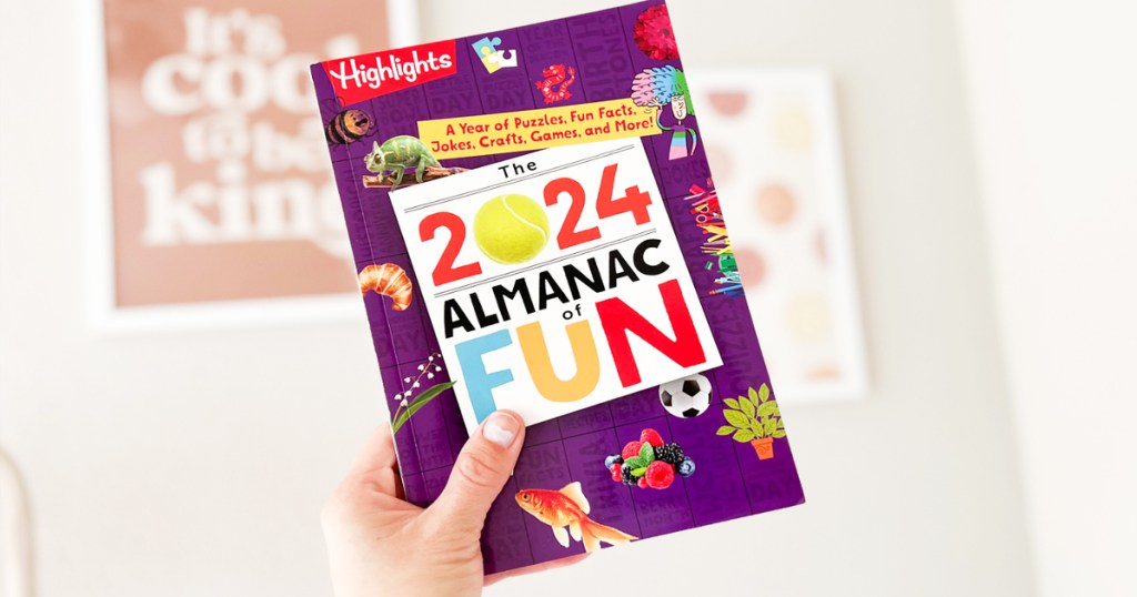 hand holding up Highlights 2024 Almanac of Fun Book