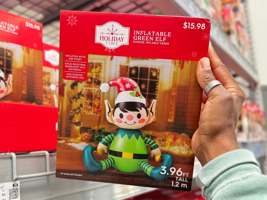 Holiday Time Inflatable Green Elf in hand in store