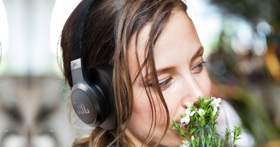 woman wearing pair of black headphones