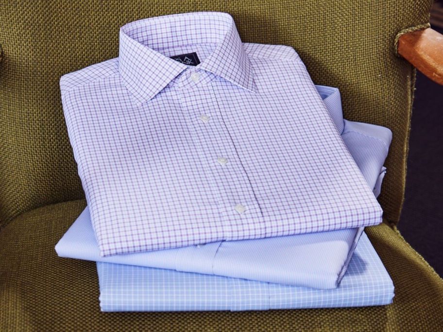 Jos A bank Dress Shirts folded on a chair