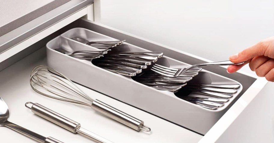 hand grabbing fork from drawer organizer tray
