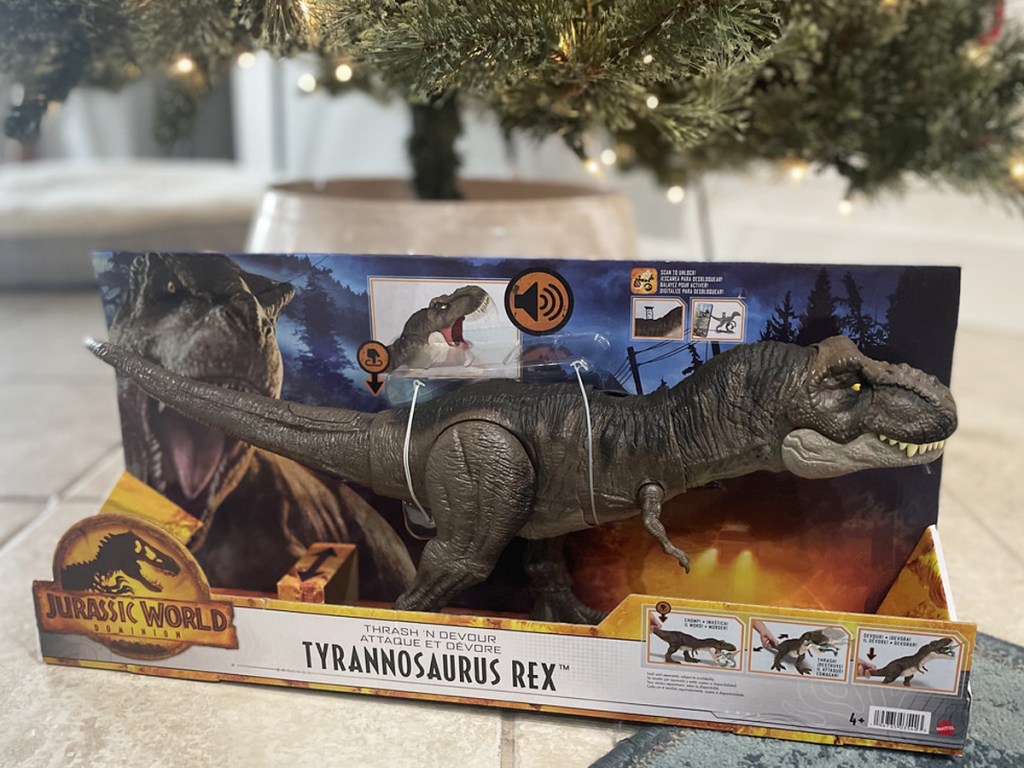 Jurrasic World Thrash N Devour Tyrannosaurus Rex on floor near Christmas tree