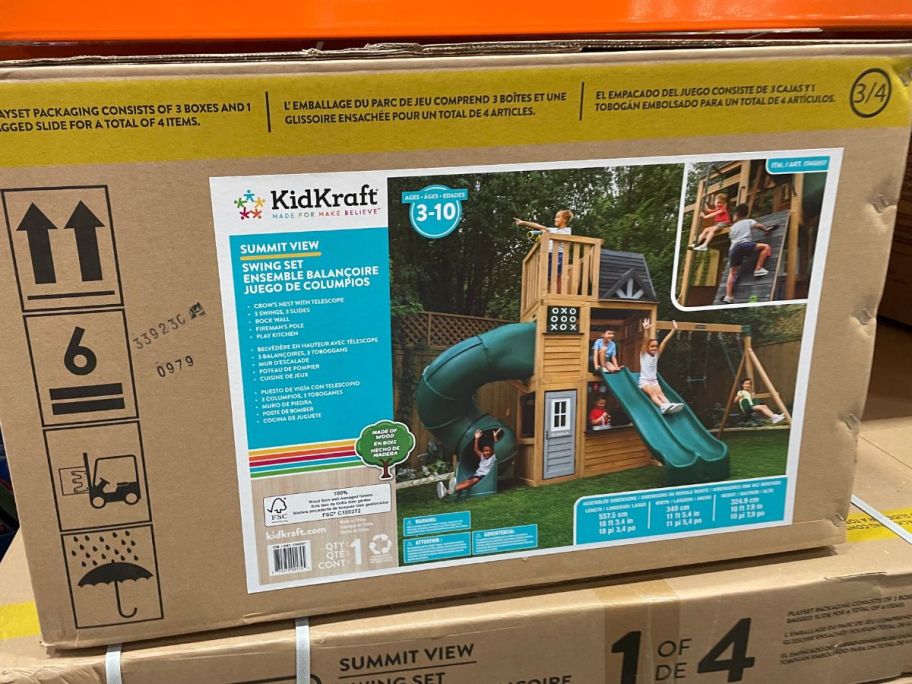 a box containing a swing set stacked on a shelf in a costco club