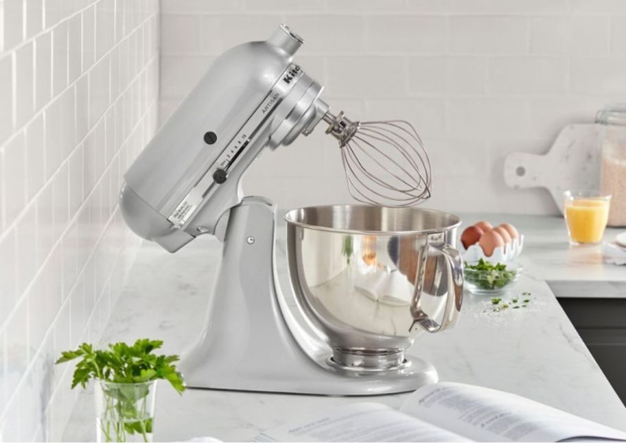 a chrome colored kitchenaid tilt head stand mixer