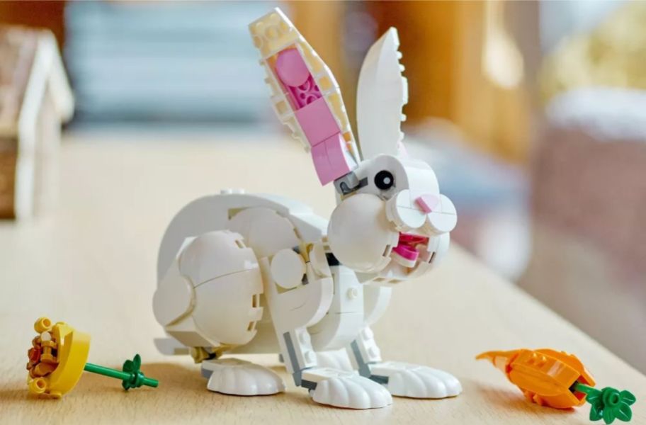 a white lego rabbit with carrot