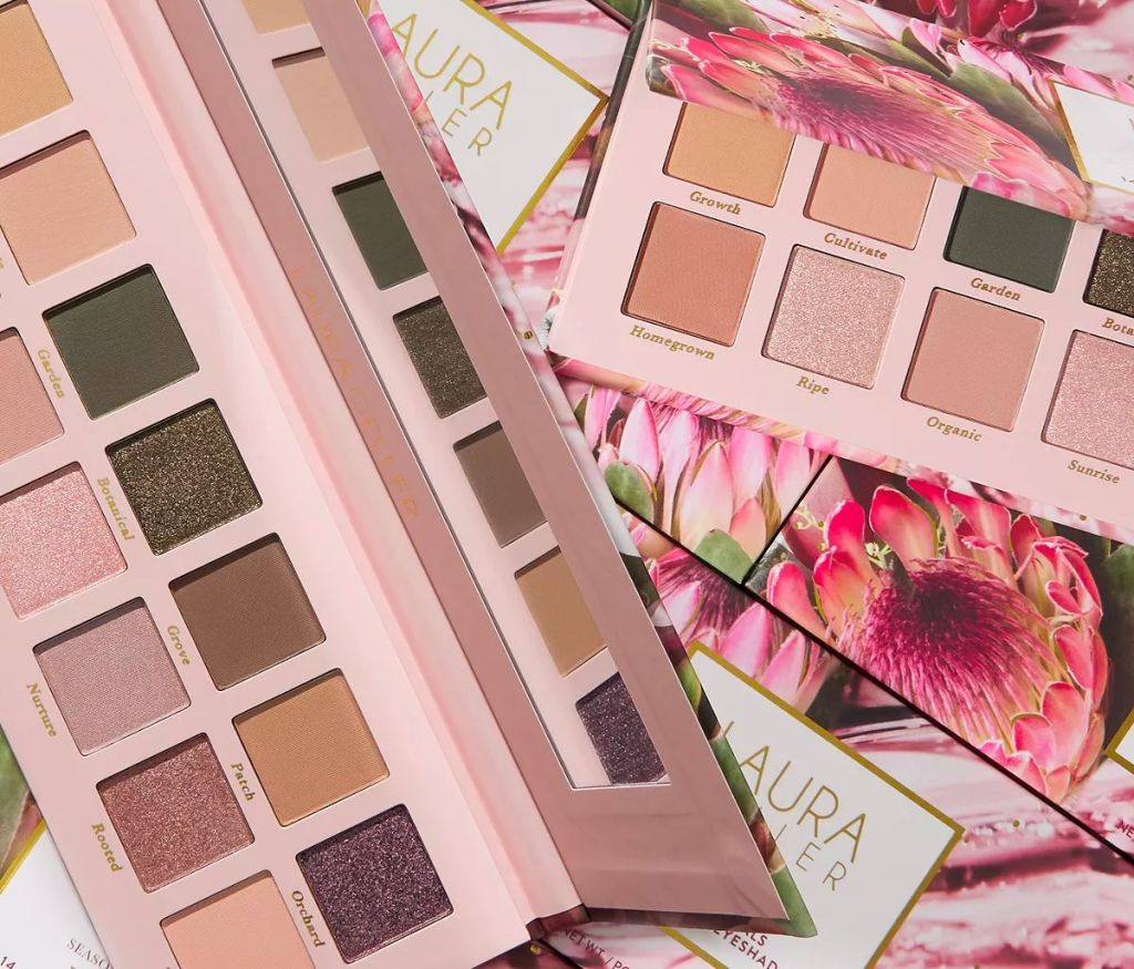two Laura Geller Beauty Seasonless Staples Eyeshadow Palettes on a floral background