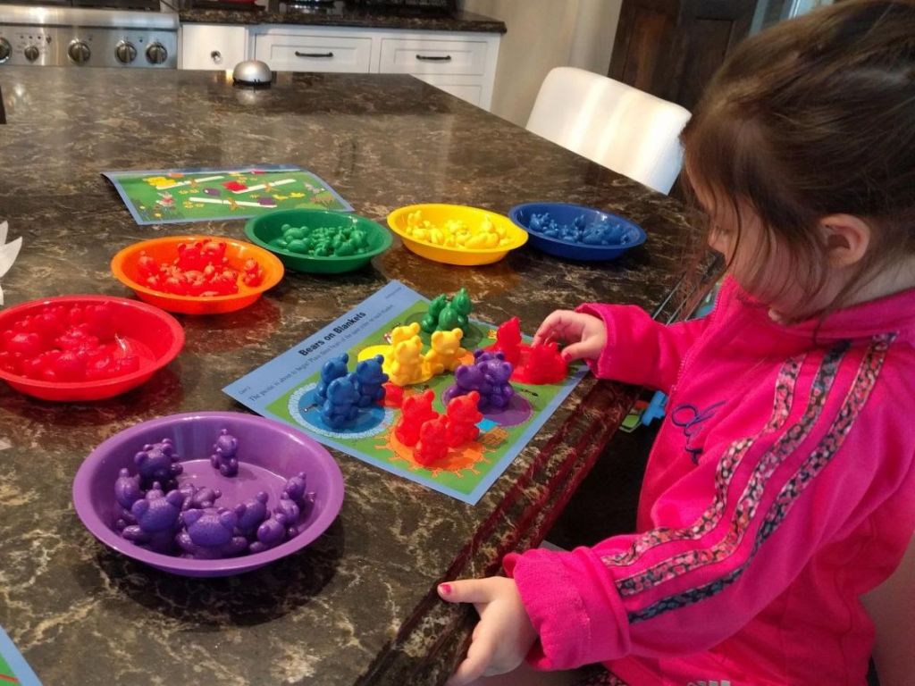 Little girl playing with the Learning Resources sorting bears