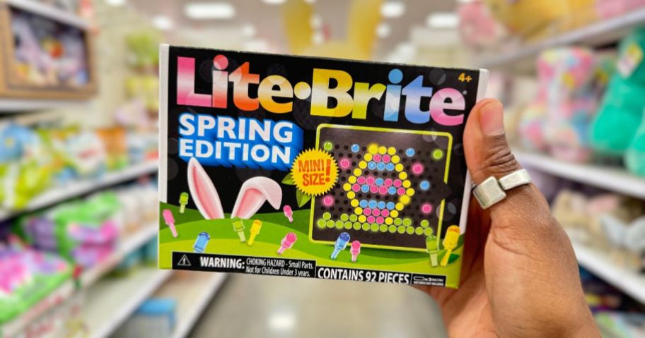 hand holding a Lite-Brite Mini Spring Edition toy