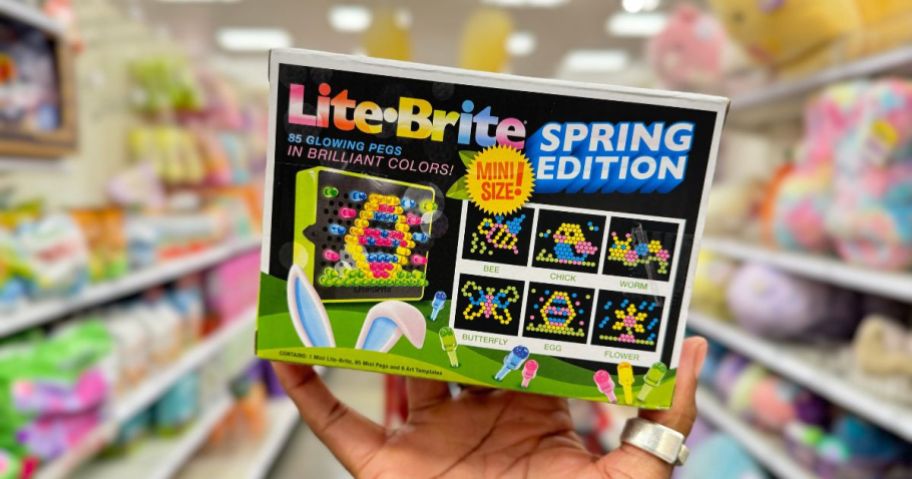 hand holding a Lite-Brite Mini Spring Edition showing the back of the box