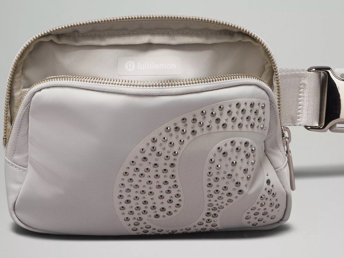 white Lululemon studded belt bag unzipped with interior showing