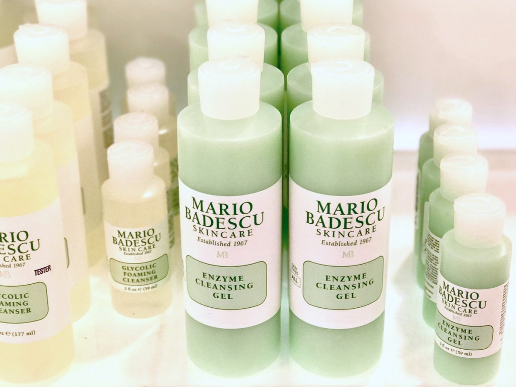 green bottles of Mario Badescu Enzyme Cleansing Gel on store shelf