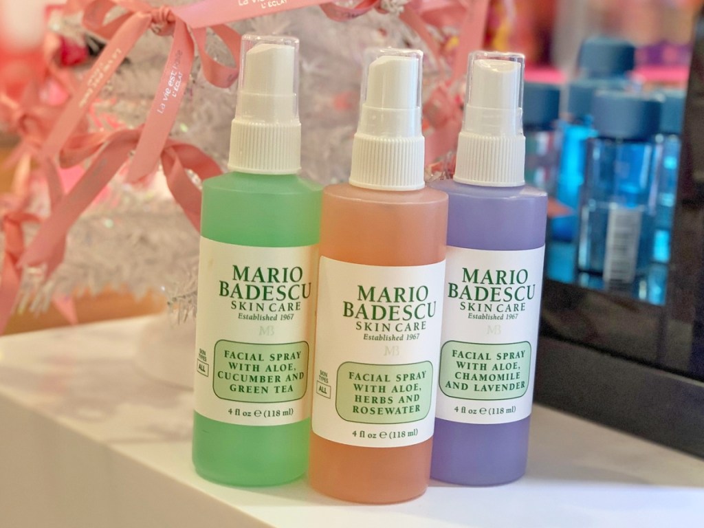 three bottles of Mario Badescu Facial Sprays on store shelf
