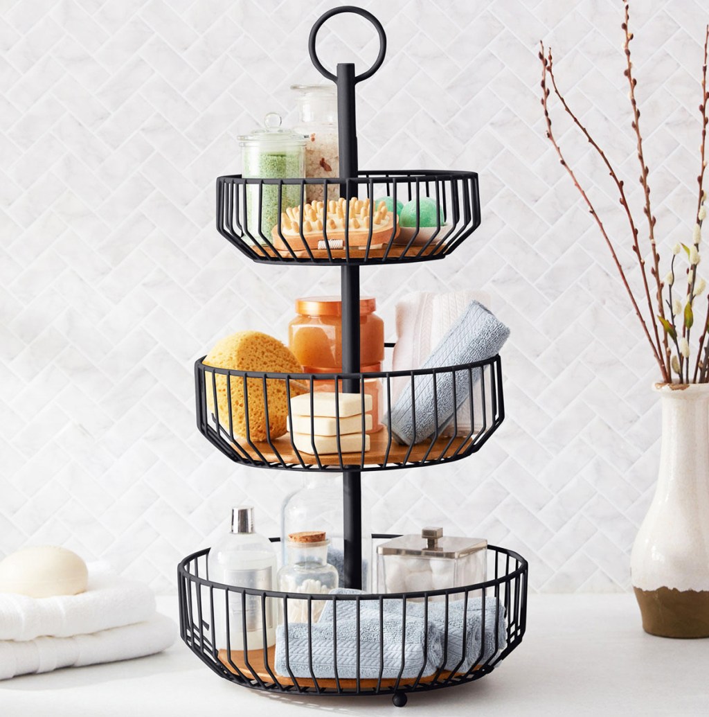 black three tier basket stand on counter