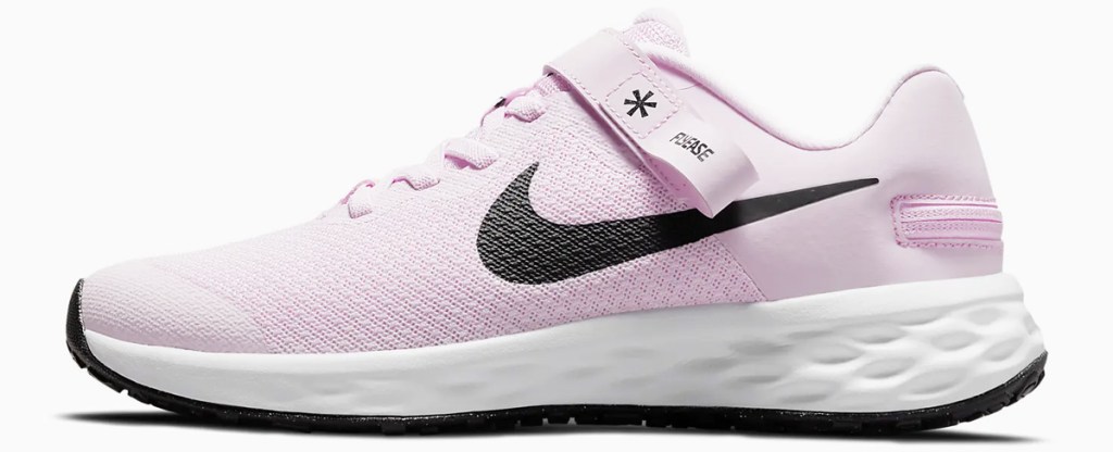 light pink and black nike running shoe