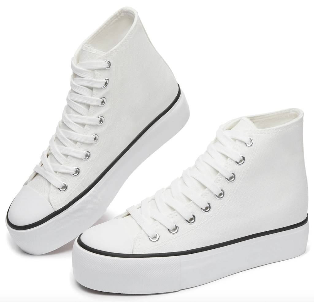 Stock photo of white high top sneakers with black detail