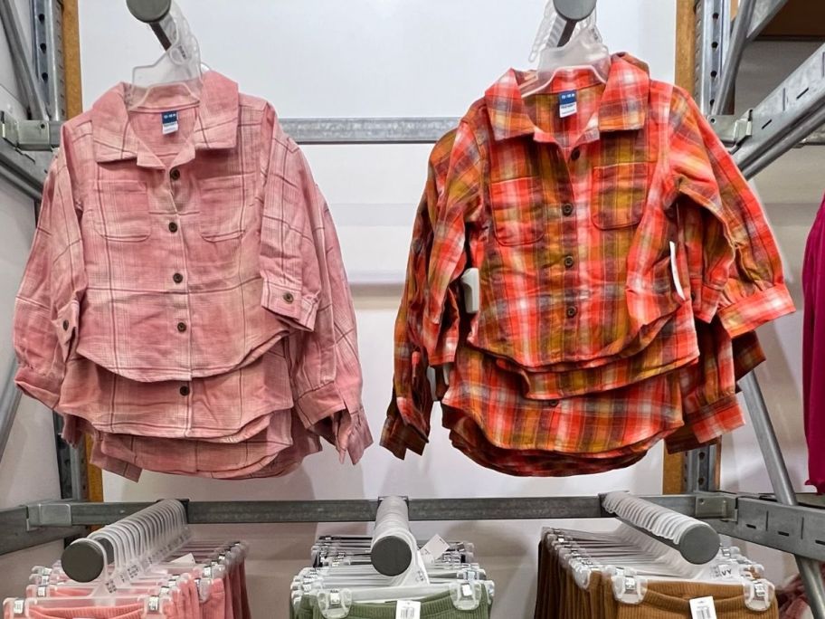 Old Navy Toddler Girls Flannel Shirts hanging in store