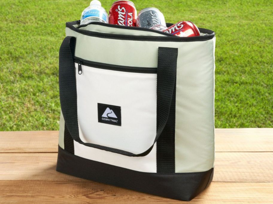 Ozark Trail 24 Can Soft Cooler Tote in Green on a picnic table