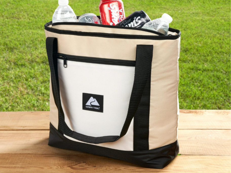 Ozark Trail 24 Can Soft Cooler Tote in Tan on a picnic table