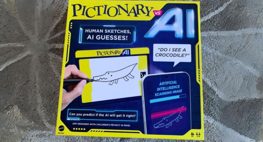 Pictionary Vs. AI game box on a gray geometric patterned rug