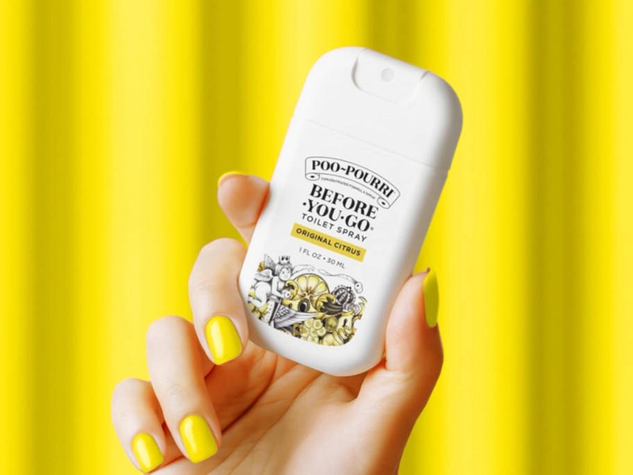 Poo-Pourri Toilet Spray 1oz Bottle with yellow background